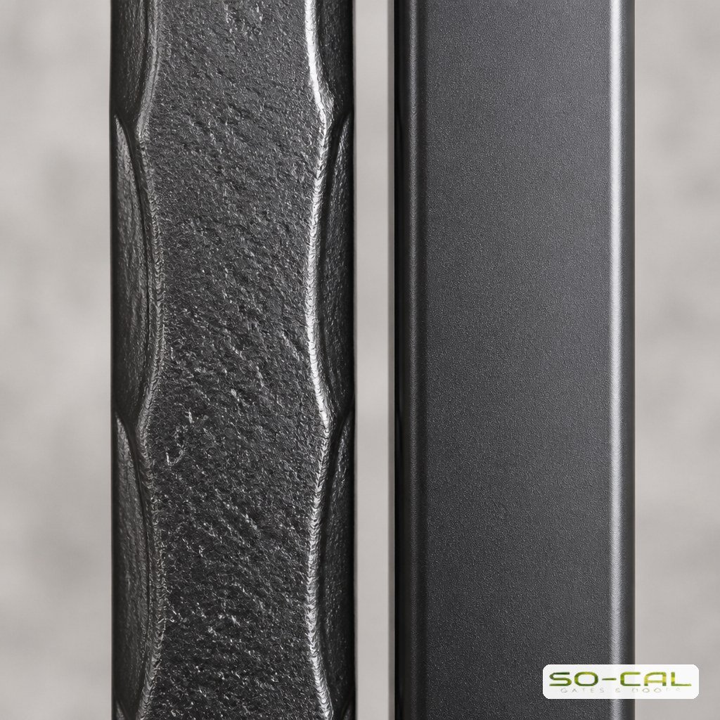 Close up comparison of a wrought iron picket and an aluminum picket